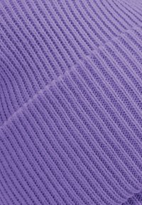 Light purple knitted fabric with fine, vertical ribbed texture. Material appears soft and stretchy, showcasing a consistent pattern throughout.