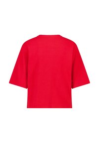 Kirkas punainen lyhythihainen laatikkomainen toppi pyöreällä pääntiellä, esitelty takaa valkoista taustaa vasten.