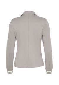 Grå kvinders jakke med krave, lange ærmer og stribede manchetter. Glat tekstur med tætsiddende design og sømdetaljer bagpå.