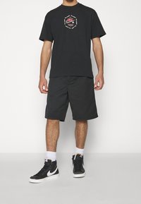 Nike Sportswear T-shirt med print - black