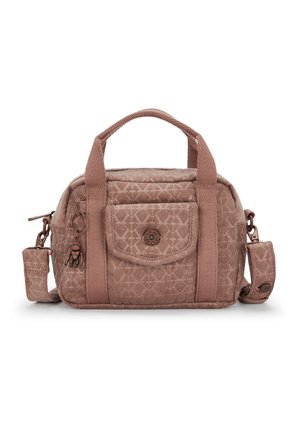 Brown corduroy handbag with a structured shape, featuring a front pocket, dual top handles, an adjustable strap, and a decorative charm.