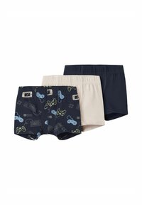 Trzy pary kąpielówek chłopięcych: jedne granatowe z grafiką do gier, jedne beżowe oraz jedne ciemnogranatowe; wszystkie wykonane z miękkiej bawełny i mają elastyczne pasy.