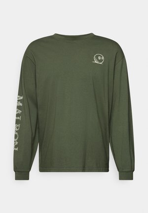 Long-sleeve olive green t-shirt made of cotton. Features a small white graphic on the chest and intricate designs along the left sleeve.
