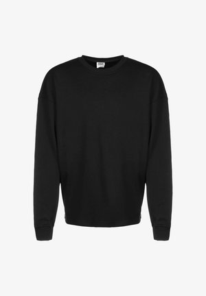 Felpa nera a maniche lunghe con scollo rotondo, polsini a costine e vestibilità rilassata, presentata su uno sfondo bianco.