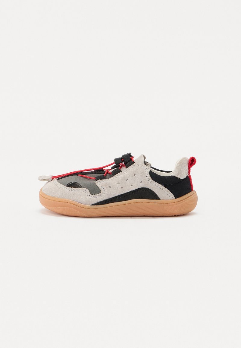 Light grey and black sneaker with rubber sole, textured suede material, red accents, and elastic laces for easy wear.