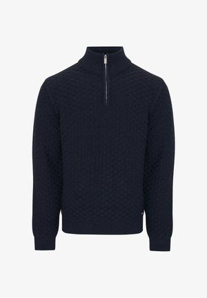 Suéter de color azul marino con un patrón de punto texturizado, cuello alto y una cremallera corta en el cuello. Puños y dobladillo acanalados.