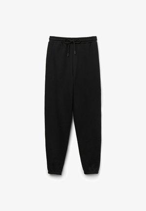 Pantalons de survêtement noirs en mélange de coton, dotés d'une taille élastique avec cordon de serrage et de chevilles fuselées.