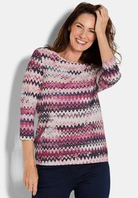 Button-up Hemd mit Zickzackmuster in Pink, Weiß und Marineblau. Mit Dreiviertelärmeln und weitem Ausschnitt. Weicher Stoff.