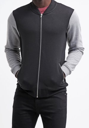 Tröja med dragkedja - black