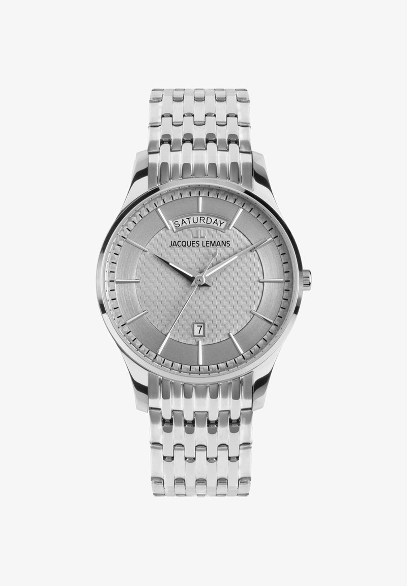 Srebrny zegarek ze stali nierdzewnej z teksturowanym szarym cyferblatem, wyświetlaczem daty i wskaźnikiem dnia. Posiada bransoletę ogniw z minimalistycznymi znacznikami godzin.