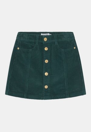 Minifalda de pana en verde oscuro con botones dorados, que presenta bolsillos delanteros y una silueta recta. Tejido texturizado con costillas.