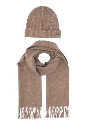 Brown knitted beanie and matching brown scarf with fringed ends, arranged on a flat white background.