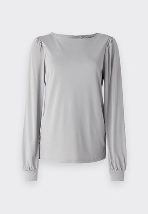 Haut gris à manches longues en matériau lisse et extensible. Il possède un col rond et des détails froncés aux manches avec des poignets élastiques.