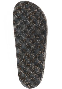 Czarna, teksturowana podeszwa buta z nakrapianym wzorem w jasnobrązowe i ciemne plamki; zaokrąglony kształt z lekko uniesioną krawędzią.