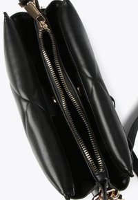 Black leather handbag featuring a quilted design, dual compartments with gold-tone zippers, and a detachable shoulder strap.