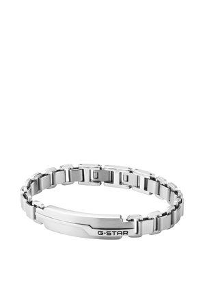 Bracciale a catena in metallo argentato con maglie rettangolari e una piastra piatta incisa con "G-STAR" su sfondo bianco.