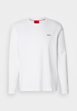 White long-sleeve shirt made of cotton, featuring a round neckline, black "HUGO" logo on the left chest, and a smooth texture.