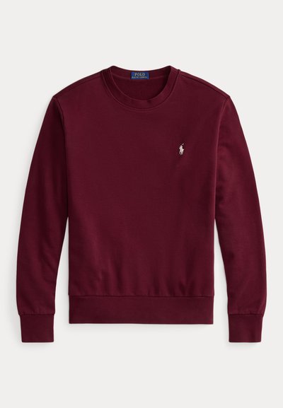 Sweatshirt bordô em algodão suave, com decote redondo e mangas longas. Pequeno logotipo bordado no peito, punhos e bainha canelados.