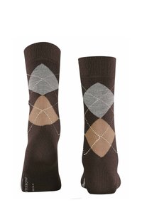 Calcetas marrones con un patrón de rombos en gris claro, gris oscuro y marrón claro, con costuras en contraste y un puño acanalado.