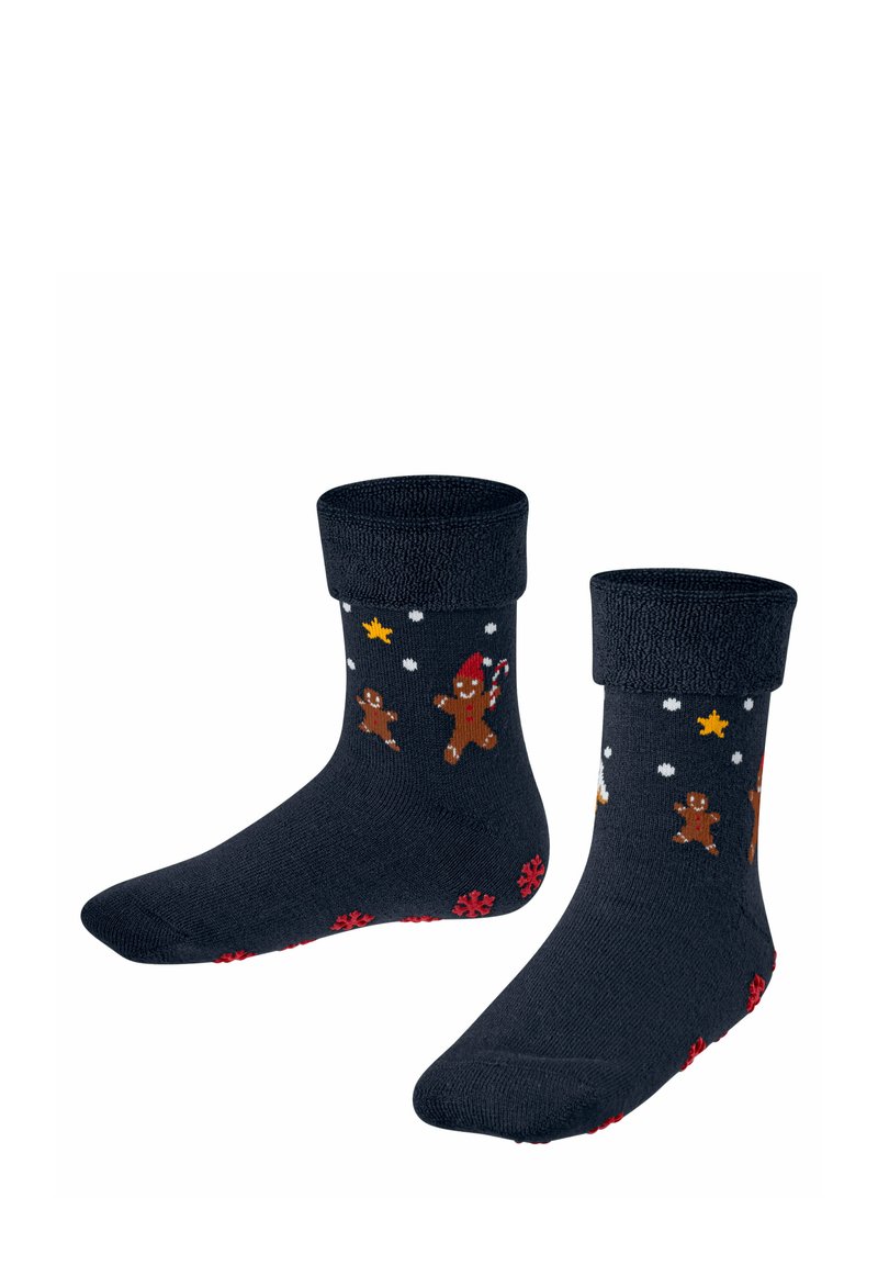 Marineblaue Socken mit einem gerollten Bündchen, die Lebkuchenmänner, Zuckerstangen und Sterne in vielen Farben zeigen, mit einem strukturierten roten Schneeflockenmuster an der Sohle.
