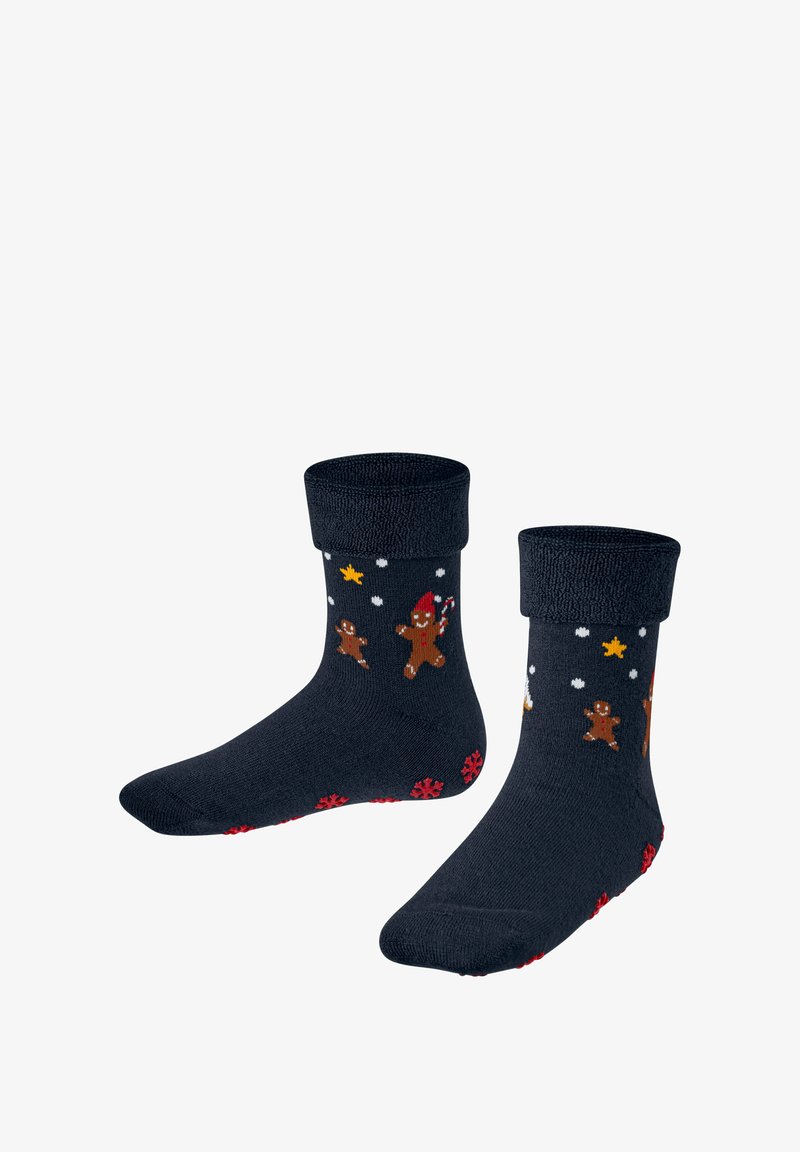 Marineblaue Socken mit einem gerollten Bündchen, die Lebkuchenmänner, Zuckerstangen und Sterne in vielen Farben zeigen, mit einem strukturierten roten Schneeflockenmuster an der Sohle.