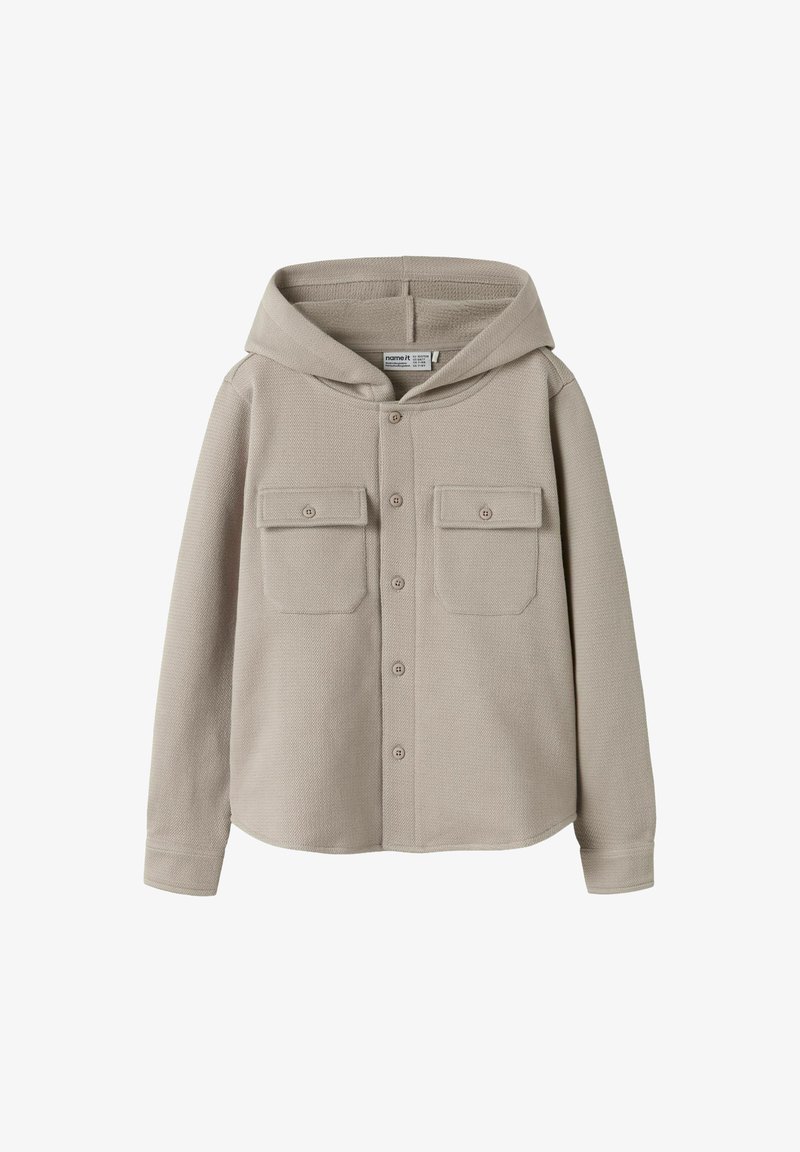 Lichtbeige hoodie-shirtjack, gestructureerde stof, twee borstzakken met kleppen, ceintuursluiting in het midden en lange mouwen.