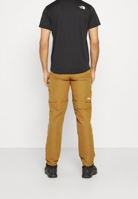 The North Face Ulkohousut - brown