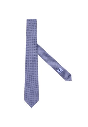 Cravatta blu navy con motivo geometrico, realizzata in tessuto simile alla seta. Sfiancata alle estremità, con un piccolo etichetta vicino all'estremità stretta.
