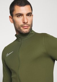 Nike Performance M NK DRY ACD21 TRK SUIT K - Fato de treino - rough green/white