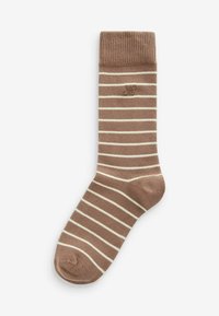 Chaussette rayée marron avec des rayures horizontales beige clair. Bord-côte et un logo dans une teinte subtile. Texture douce, forme de chaussette standard.
