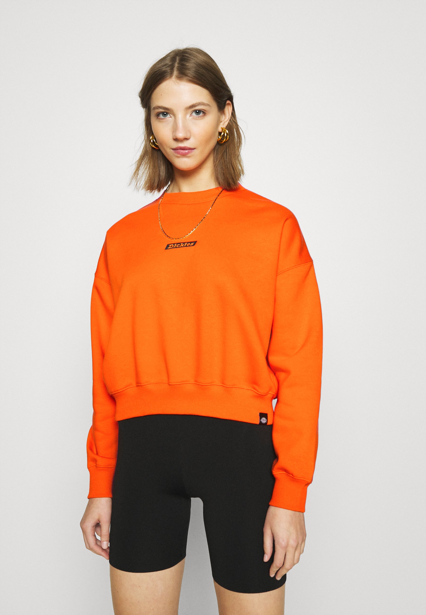 bright orange sweatshirt
