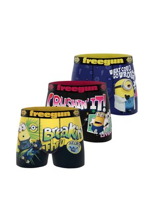 Trois paires de boxers colorés avec des personnages des Minions et des phrases comme "Breakin’ Thru" et "Crushin’ It" sur des fonds noir, jaune et bleu.