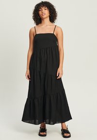 Musthave mustra vestid mustarate must rasvljan mustka krahnu mustava krahdisain krahunniga, jalgneva voolusma kõrge ja voğu koostisega, mis on valmistatud kergetest kangastest mugavuse tagamiseks.