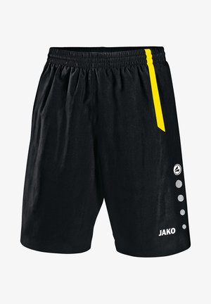 Pantaloni sportivi neri realizzati in materiale leggero, con una striscia laterale gialla, vita elastica e dettagli circolari accentati.