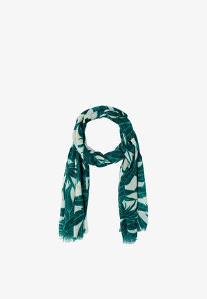 Leichter Schal mit grünem tropischem Blattmuster auf weißem Hintergrund, locker in einer Schlaufe drapiert mit fransigen Rändern.