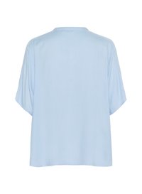 Top azzurro chiaro a maniche corte con vestibilità ampia, scollatura rotonda e texture liscia. Design semplice, senza motivi o decorazioni visibili.
