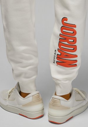 PANT - Tracksuit bottoms - phantom/rush orange