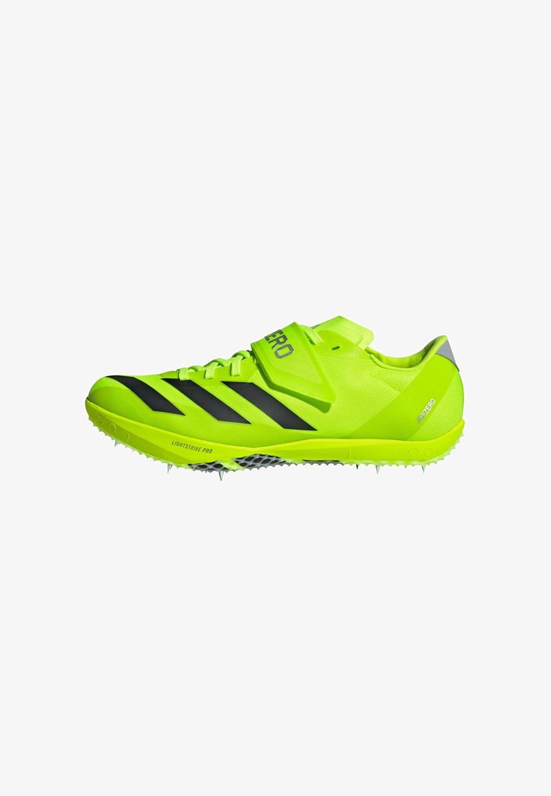 Neon green athletic shoes with black stripes, a lightweight mesh upper, a secure strap, and spike outsole for traction.