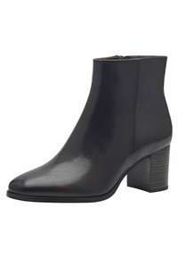 Bottine en cuir noir avec un bout pointu, texture lisse, légère brillance et un talon bloqué moyen. Fermeture zippée sur le côté pour un enfilage facile.