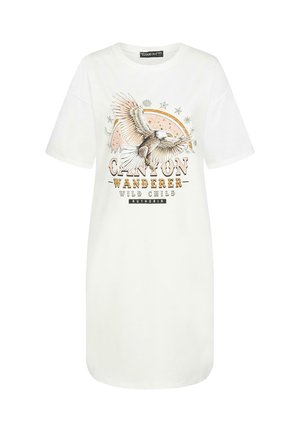 White cotton T-shirt dress with short sleeves, featuring a graphic of an eagle and text "CANYON WANDERER WILD CHILD" in earthy tones.