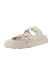 Lichtbeige rubberen sandalen met twee verstelbare banden, gestructureerde details en een dikke plateauzool. De merknaam is in de banden geperst.