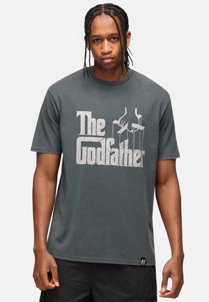 Gray cotton t-shirt with short sleeves, featuring white "The Godfather" print and graphic of hands holding marionette strings on the front.