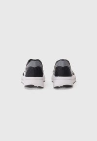 Black and gray athletic shoes with a smooth upper, cushioned heel, breathable mesh accents, and a white rubber sole.