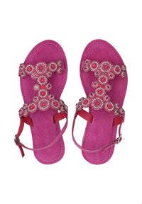 Roze suède sandalen met een decoratieve beaded band met ronde patronen en verstelbare enkelbanden. Platte zool, open teen ontwerp.