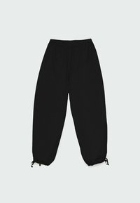 Pantalon de jogging noir avec taille élastique, jambes fuselées et cordons réglables aux chevilles. Tissu à texture lisse.