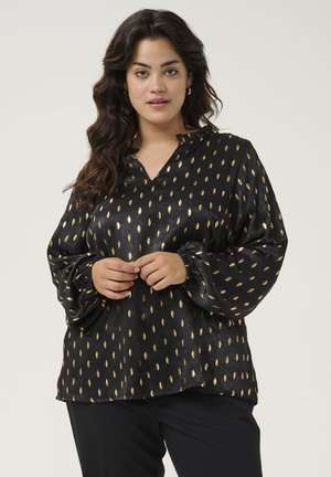Blouse noire avec un décolleté en V et un col froncé, ornée d'un motif de feuilles dorées, avec des manches longues bouffantes à poignets élastiques et une texture lisse.