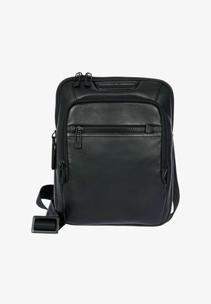 Sac bandoulière en cuir noir avec deux compartiments zippés, sangle réglable et surface texturée. Présente un design élégant et une quincaillerie discrète.