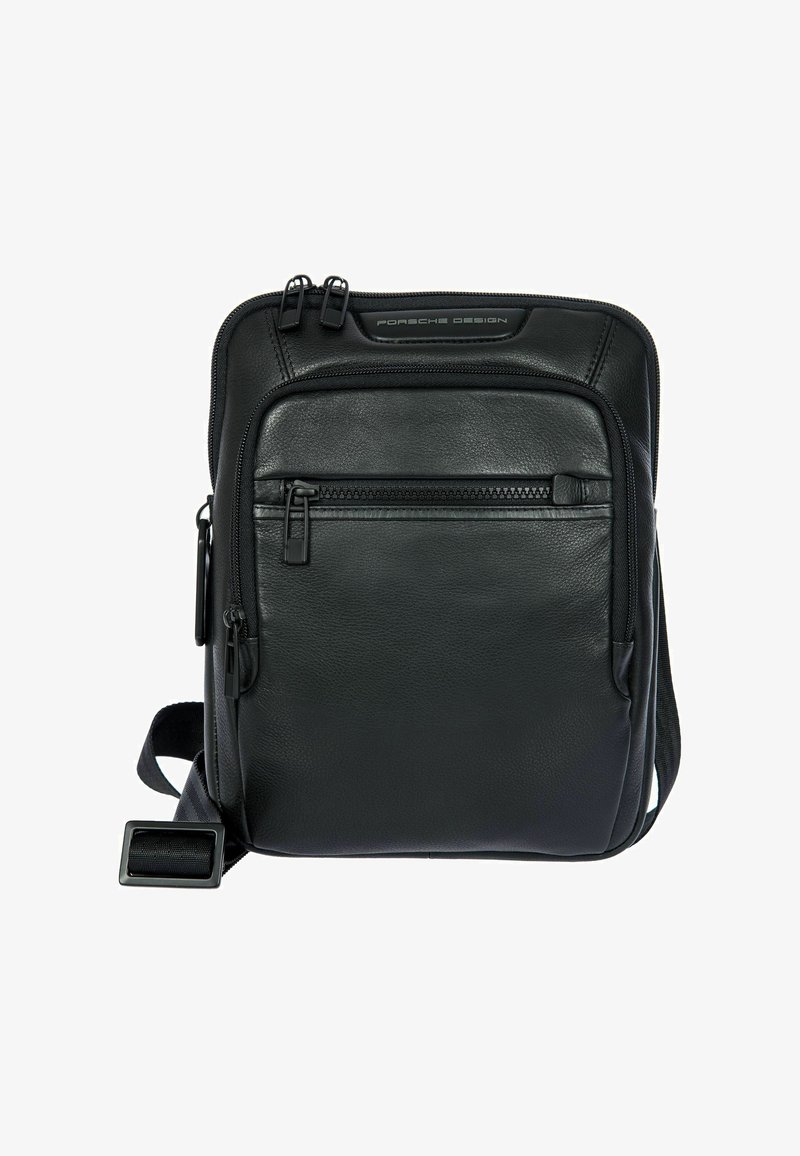 Black leather crossbody bag with two zippered compartments, adjustable strap, and textured surface. Features a sleek design and understated hardware.