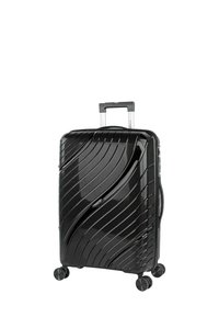 Maleta rígida negra con una superficie texturizada ondulada, cuatro ruedas y un asa retráctil para facilitar su maniobrabilidad.
