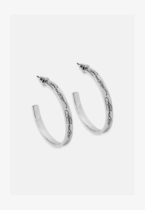 Silver hoop earrings with a polished finish, featuring a curved design and engraved script detail along the outer edge.